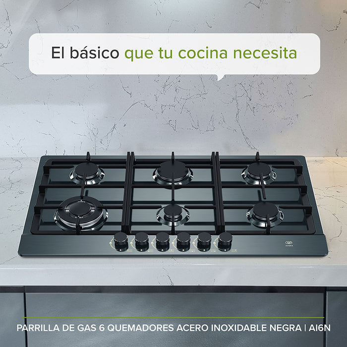 Parrilla de gas con quemadores de distintos tamaños empotrada en un mueble de cocina